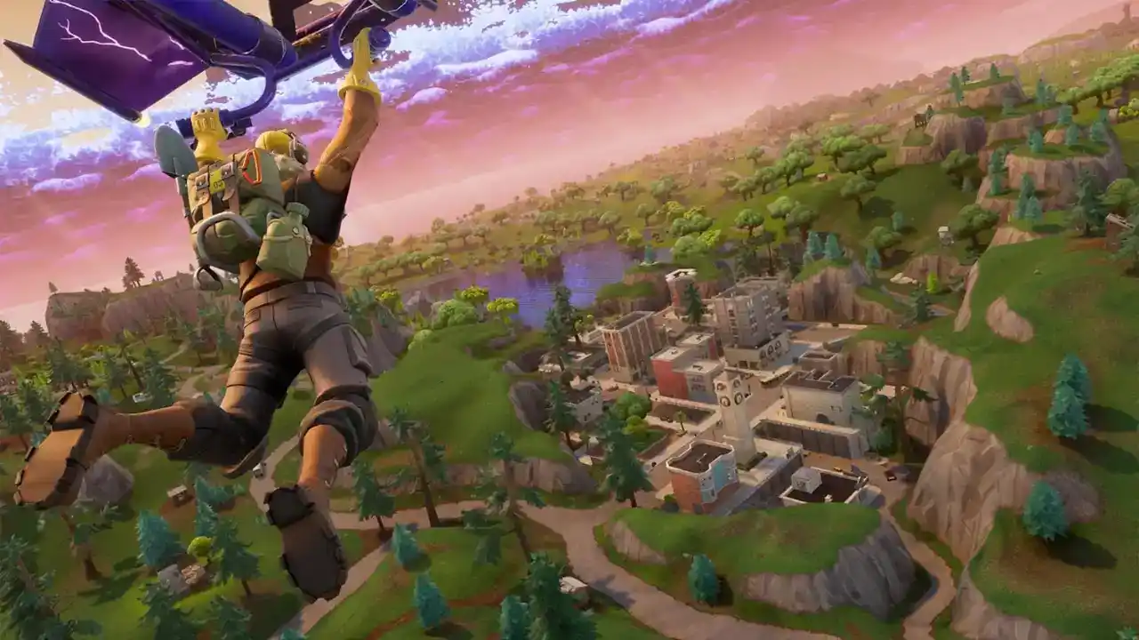 Vista aérea de un jugador descendiendo en paracaídas hacia el mapa de Fortnite, representando el modelo de juegos como servicio que domina la atención del mercado.